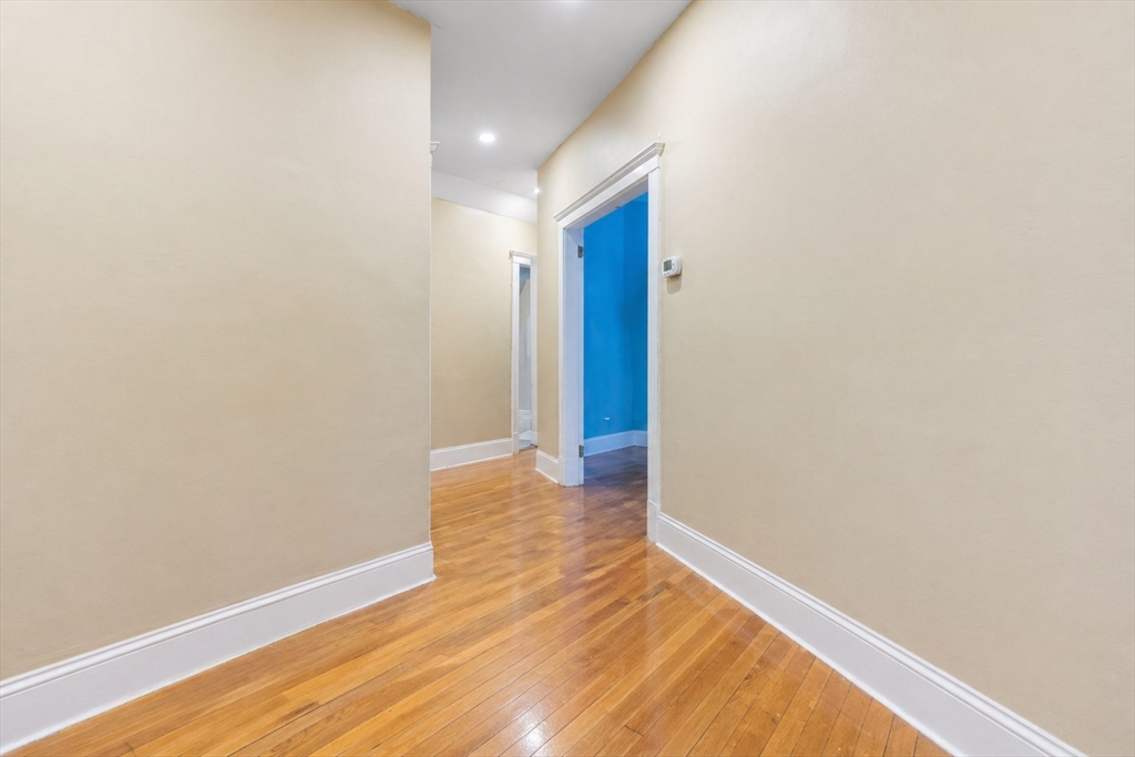21 Sutherland Road, Unit 6 Boston, MA 02135 - Photo 4 of 20 a view of hallway with wooden floor