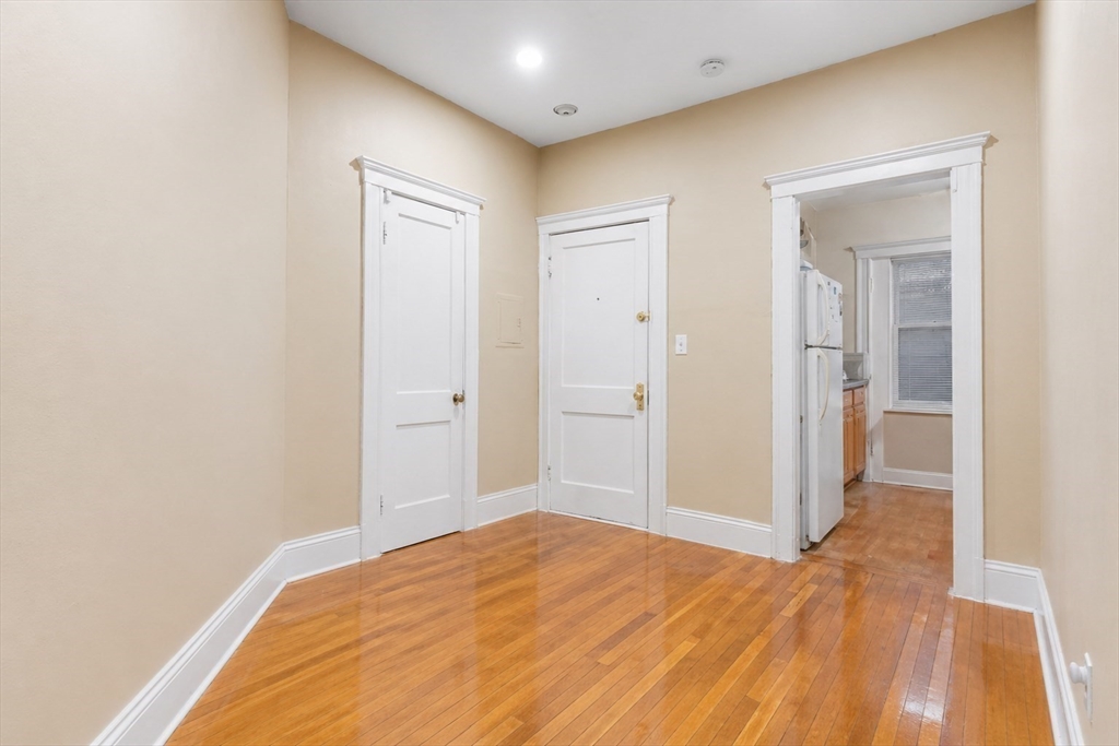 21 Sutherland Road, Unit 6 Boston, MA 02135 - Photo 5 of 20 a view of a big room with wooden floor and closet
