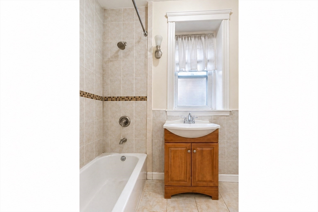 21 Sutherland Road, Unit 6 Boston, MA 02135 - Photo 10 of 20 a bathroom with a sink a toilet and shower