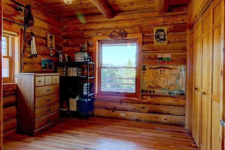 267 Citadel Road Trail, OR 97541 - Photo 11 of 30 a room with lots of wooden furniture and a window
