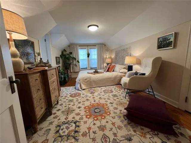 a bed room with furniture and a window