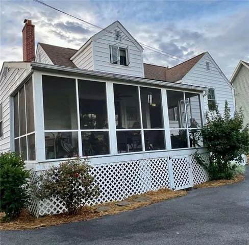 a view of a brick house with a large window