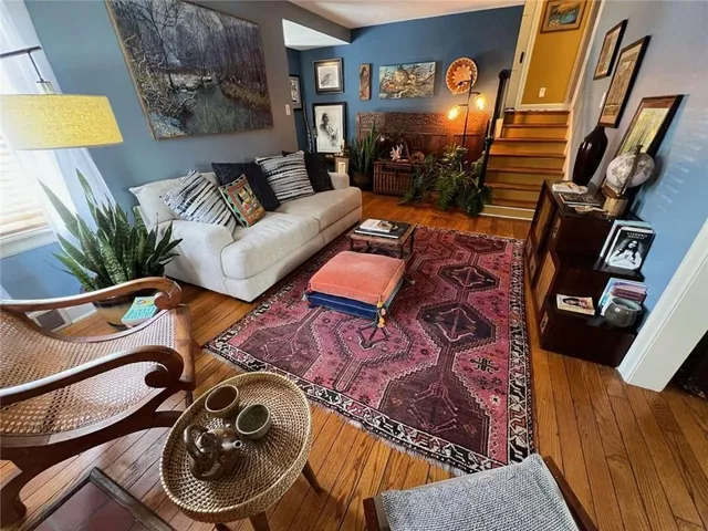 a living room with furniture and a flat screen tv