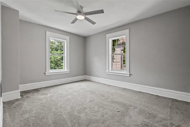 a view of an empty room with a window