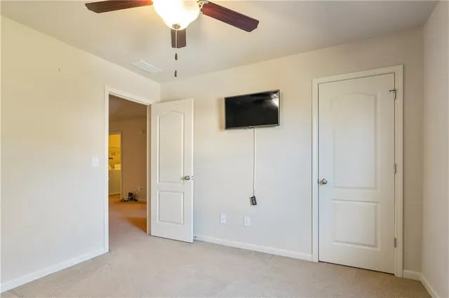 a view of cabinets and entryway with window