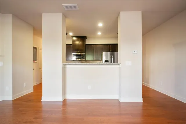 a view of kitchen with wooden floor