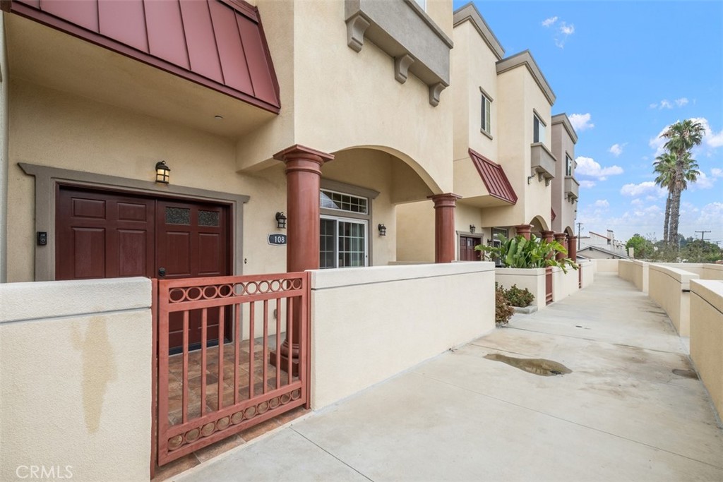 900 Dwight Avenue, Unit 108 Compton, CA 90220 - Photo 1 of 49 a view of front door and potted plants