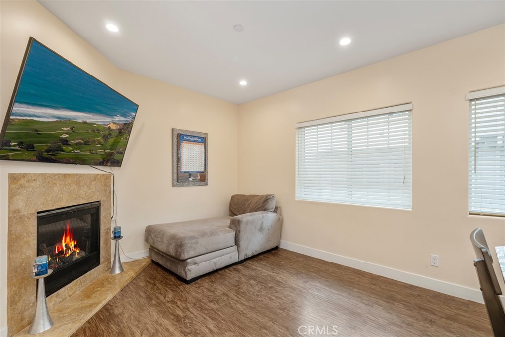 900 Dwight Avenue, Unit 108 Compton, CA 90220 - Photo 18 of 49 a living room with furniture and a fireplace