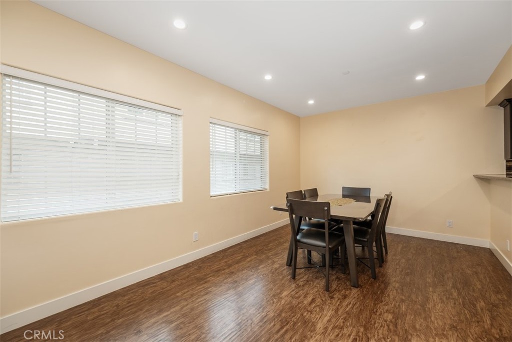 900 Dwight Avenue, Unit 108 Compton, CA 90220 - Photo 19 of 49 a dining room with furniture and wooden floor