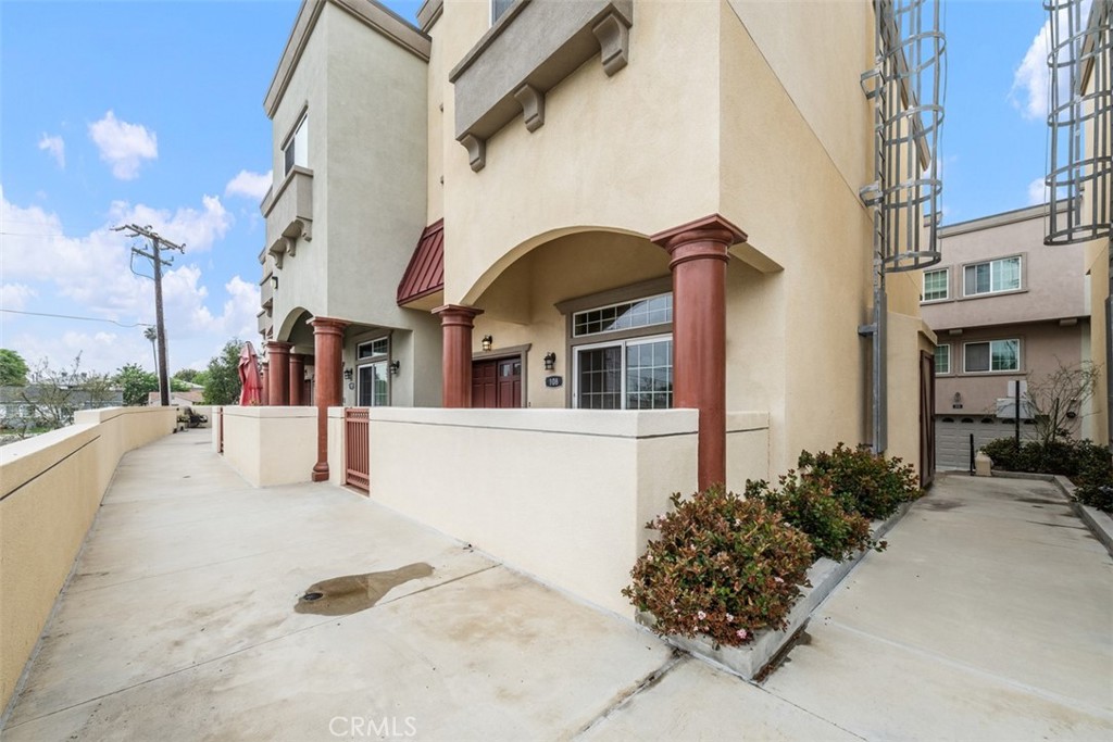 900 Dwight Avenue, Unit 108 Compton, CA 90220 - Photo 2 of 49 a house view with a outdoor space