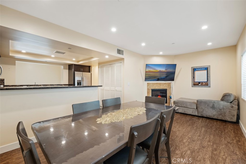 900 Dwight Avenue, Unit 108 Compton, CA 90220 - Photo 21 of 49 a living room with furniture and a flat screen tv