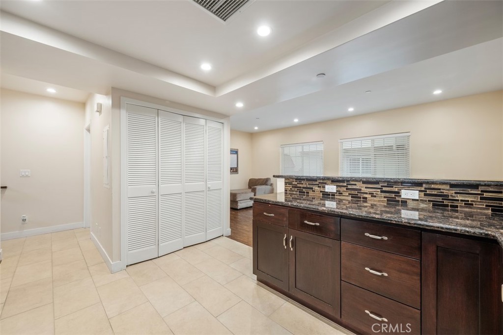 900 Dwight Avenue, Unit 108 Compton, CA 90220 - Photo 24 of 49 a kitchen with stainless steel appliances granite countertop a sink and cabinets