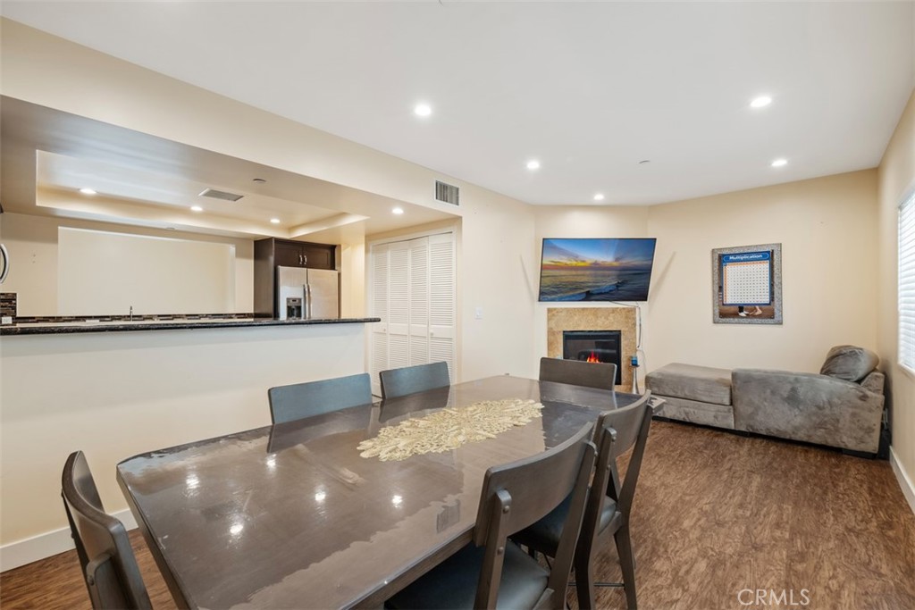 900 Dwight Avenue, Unit 108 Compton, CA 90220 - Photo 28 of 49 a living room with furniture and a flat screen tv