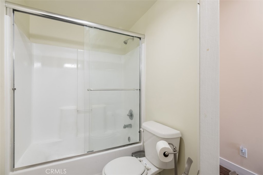 900 Dwight Avenue, Unit 108 Compton, CA 90220 - Photo 32 of 49 a bathroom with a shower a toilet and a sink