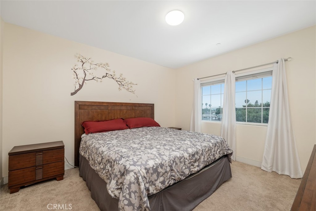 900 Dwight Avenue, Unit 108 Compton, CA 90220 - Photo 35 of 49 a bedroom with a bed and window