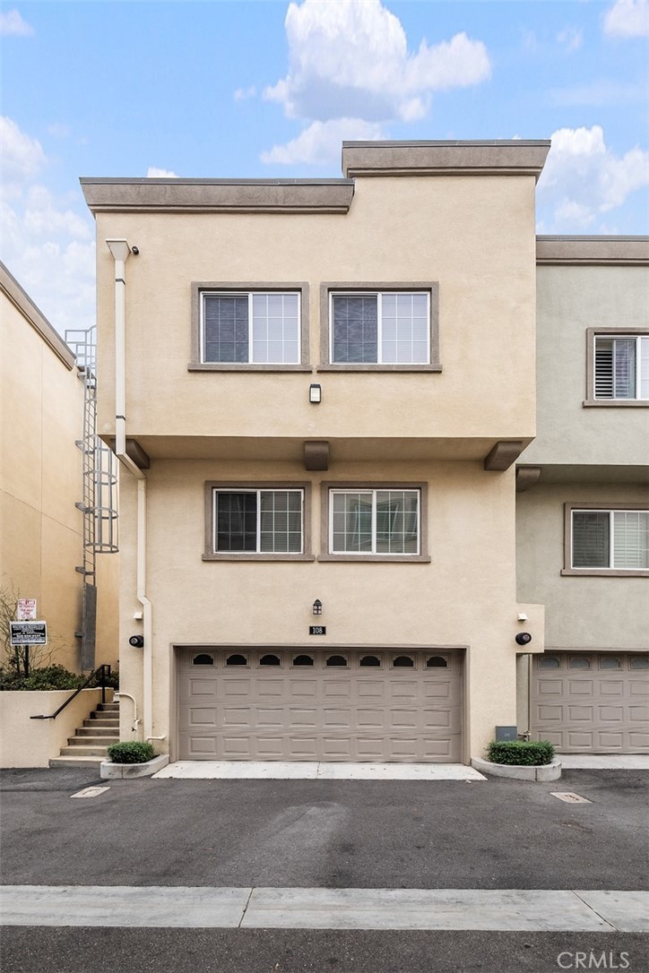 900 Dwight Avenue, Unit 108 Compton, CA 90220 - Photo 42 of 49 a front view of a house with a road