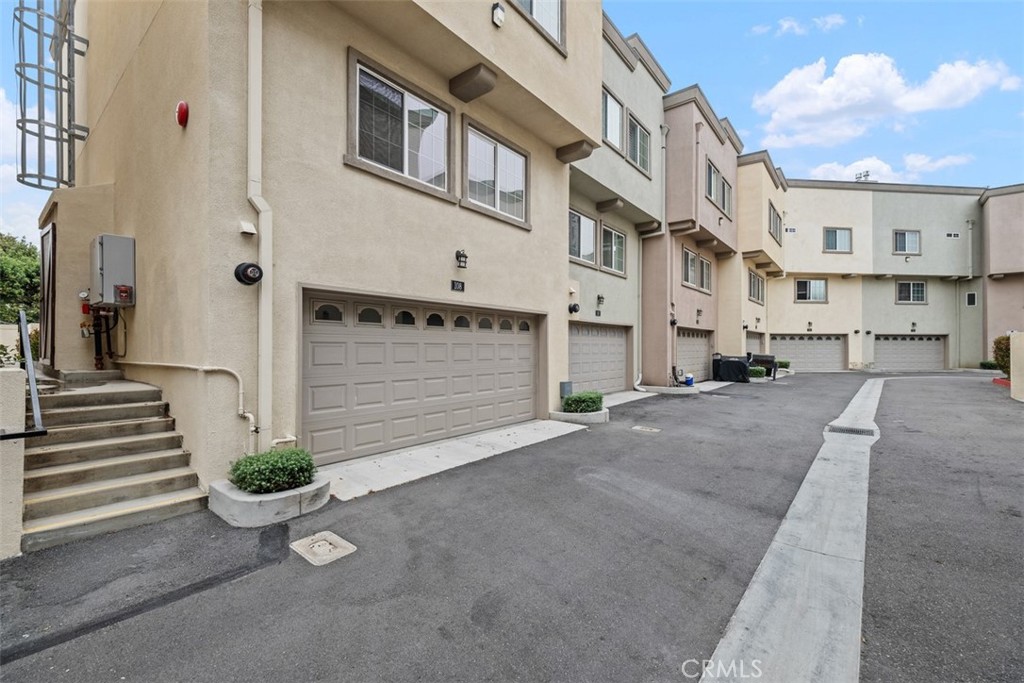900 Dwight Avenue, Unit 108 Compton, CA 90220 - Photo 43 of 49 a view of a street with potted plants