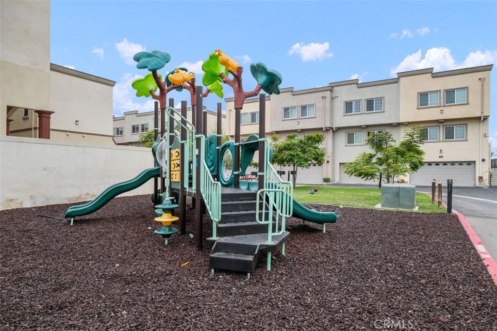 900 Dwight Avenue, Unit 108 Compton, CA 90220 - Photo 44 of 49 a view of a garden with a slide