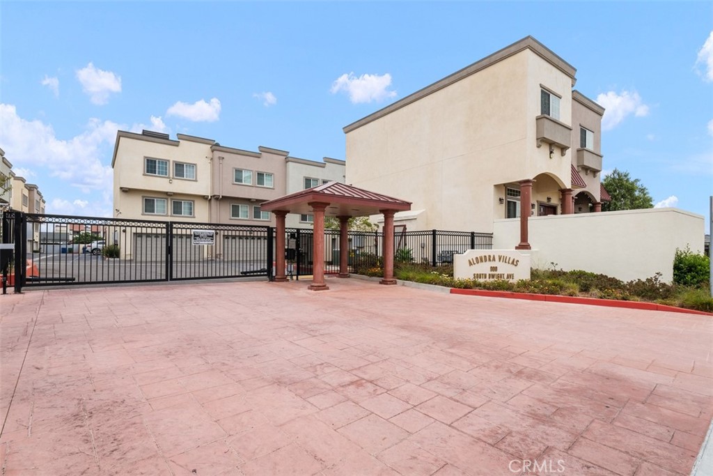 900 Dwight Avenue, Unit 108 Compton, CA 90220 - Photo 47 of 49 a view of a house with a yard