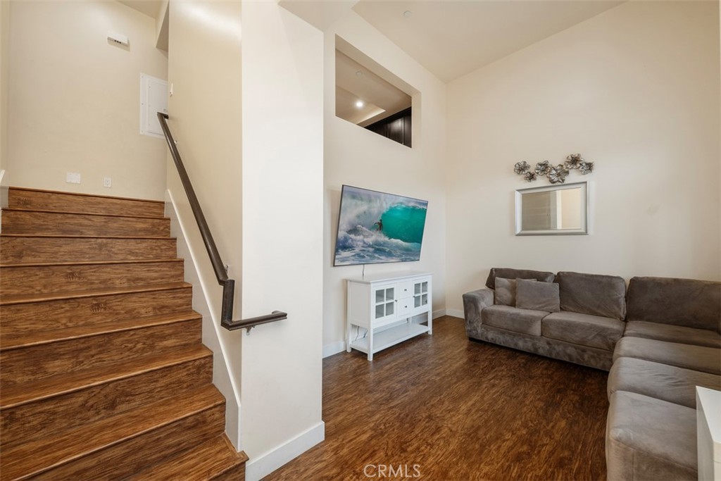 900 Dwight Avenue, Unit 108 Compton, CA 90220 - Photo 7 of 49 a living room with furniture and a flat screen tv