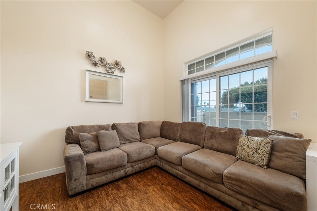 900 Dwight Avenue, Unit 108 Compton, CA 90220 - Photo 9 of 49 a living room with furniture and a window