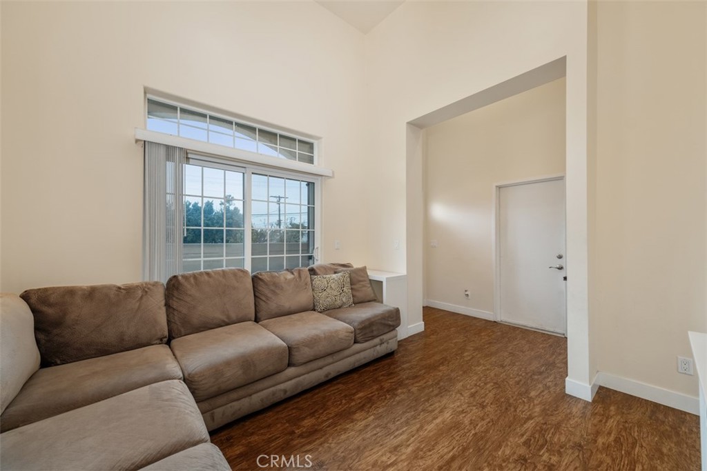 900 Dwight Avenue, Unit 108 Compton, CA 90220 - Photo 10 of 49 a living room with furniture and a window