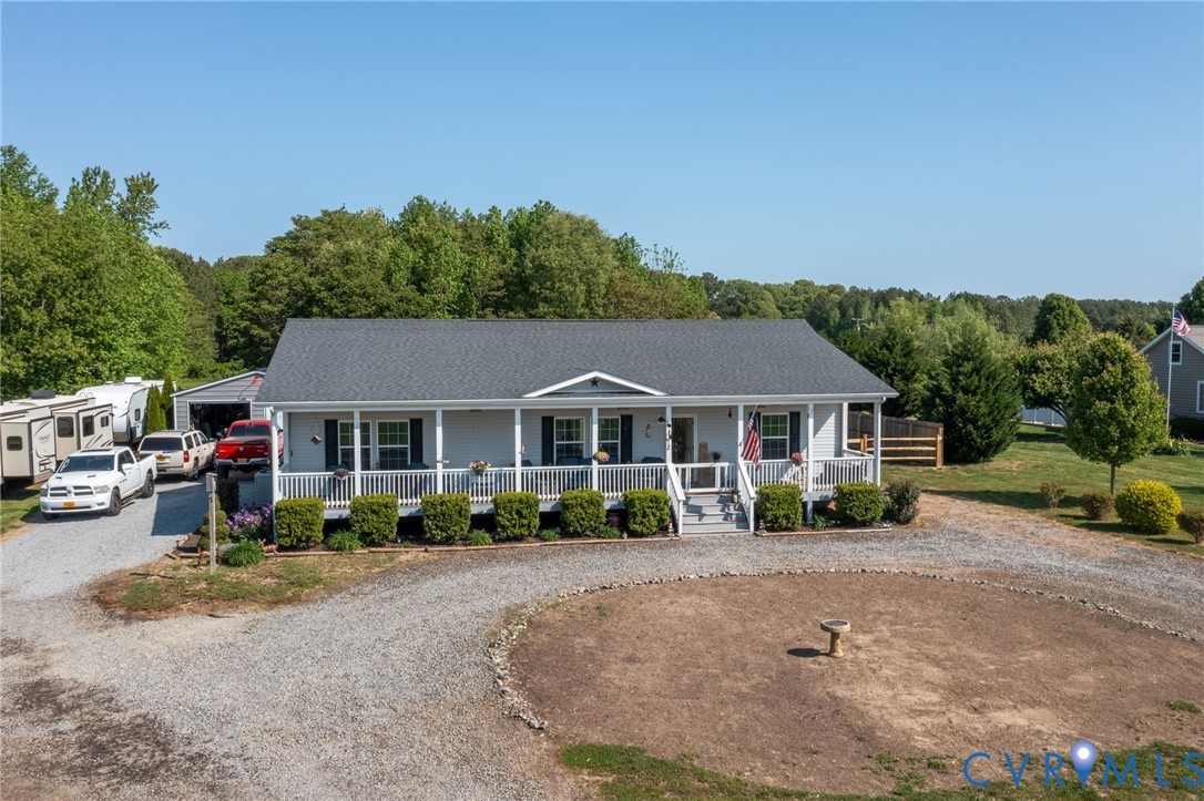 273 Greenfield Point Drive Reedville, VA 22539 - Photo 2 of 42 front view of a house with a patio