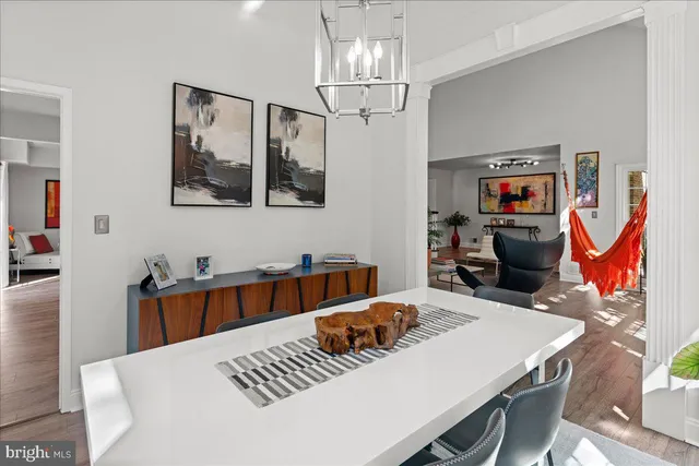 a bathroom with a granite countertop toilet a sink and mirror