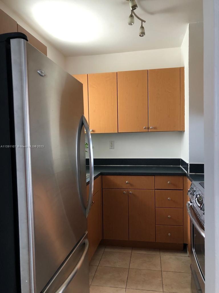 Shorecrest Miami, FL 33138 - Photo 4 of 18 a kitchen with stainless steel appliances granite countertop a refrigerator and a sink