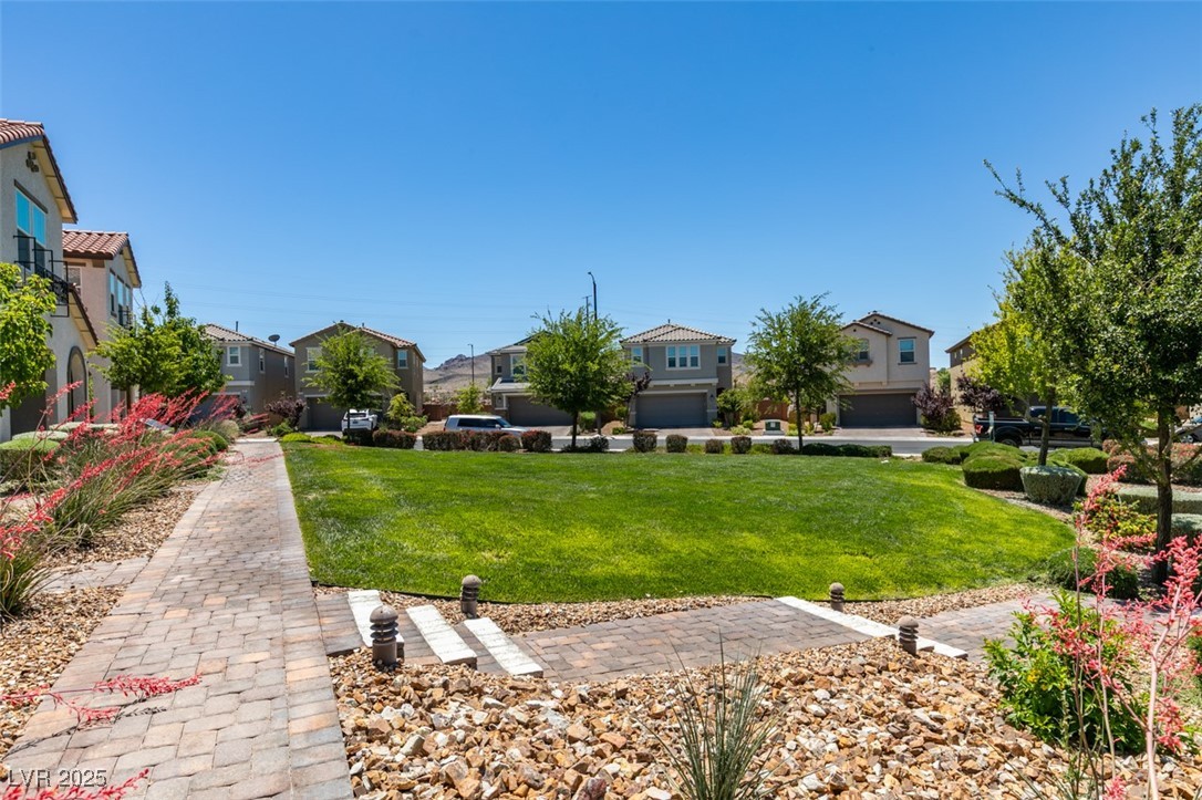 2870 Turnstone Ridge Street Henderson, NV 89044 - Photo 2 of 50 View of green lawn with a residential view