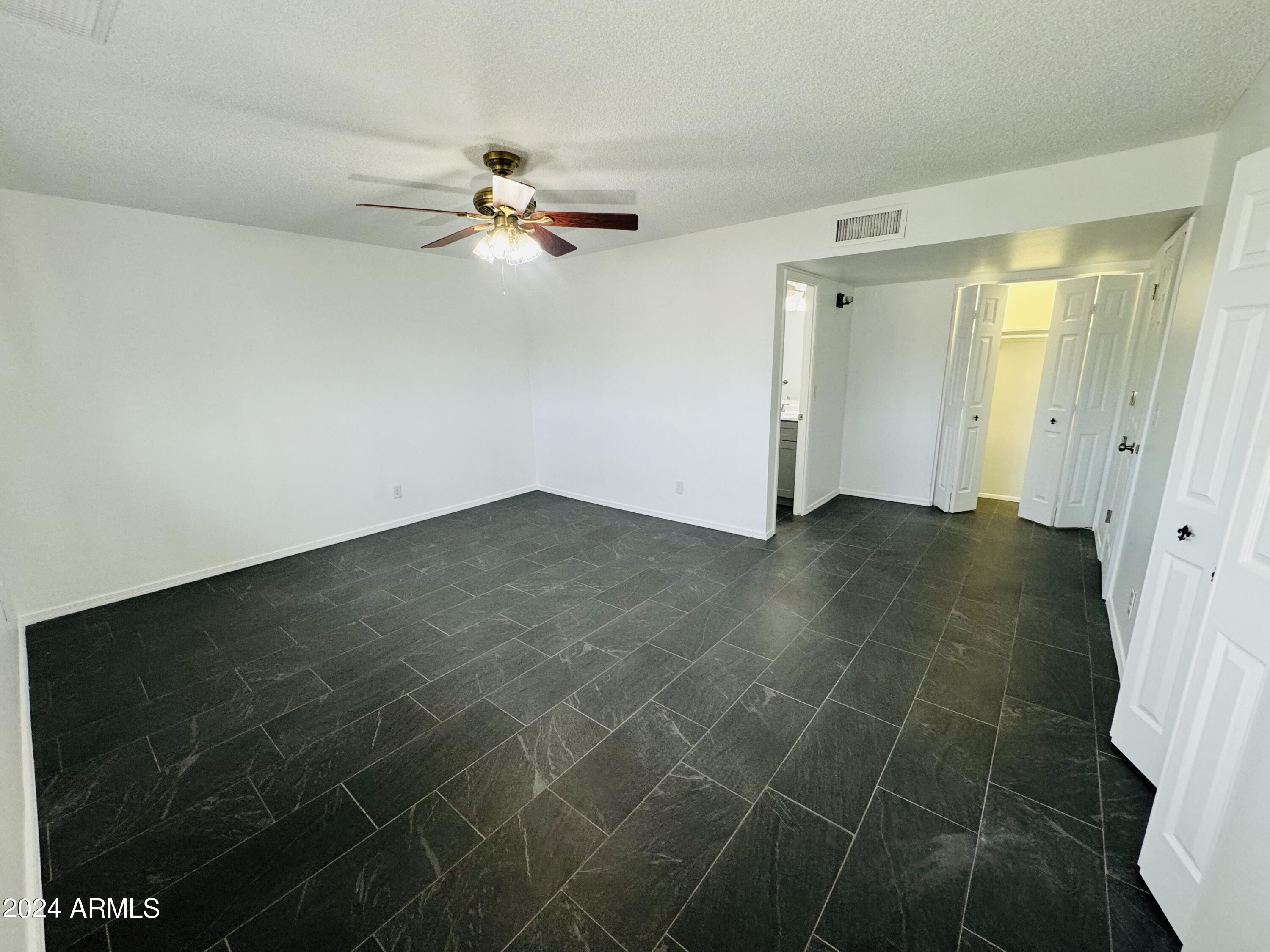 1216 East Riviera Drive Tempe, AZ 85282 - Photo 13 of 33 an empty room with a bathroom