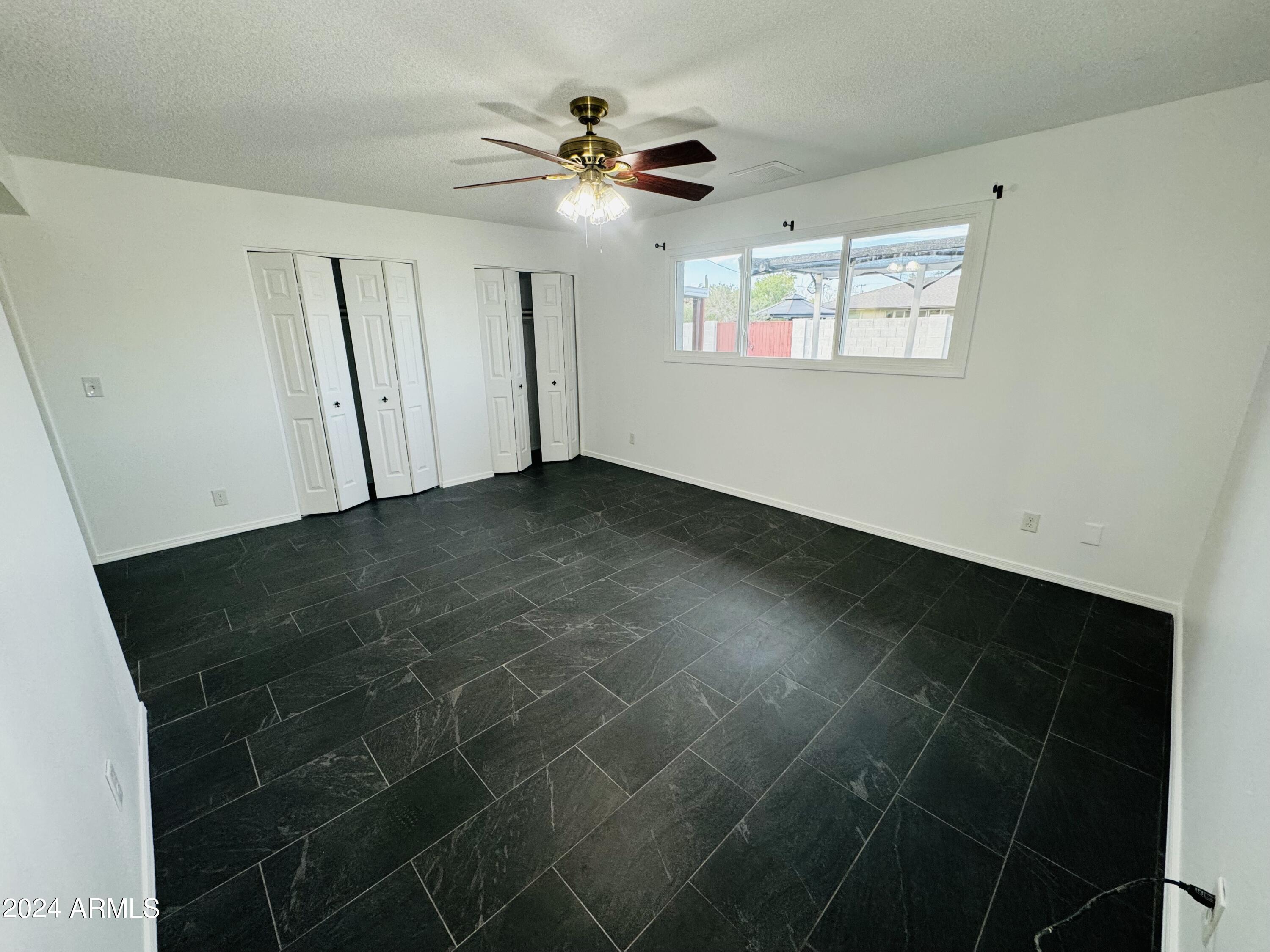1216 East Riviera Drive Tempe, AZ 85282 - Photo 15 of 33 a view of an empty room with a window