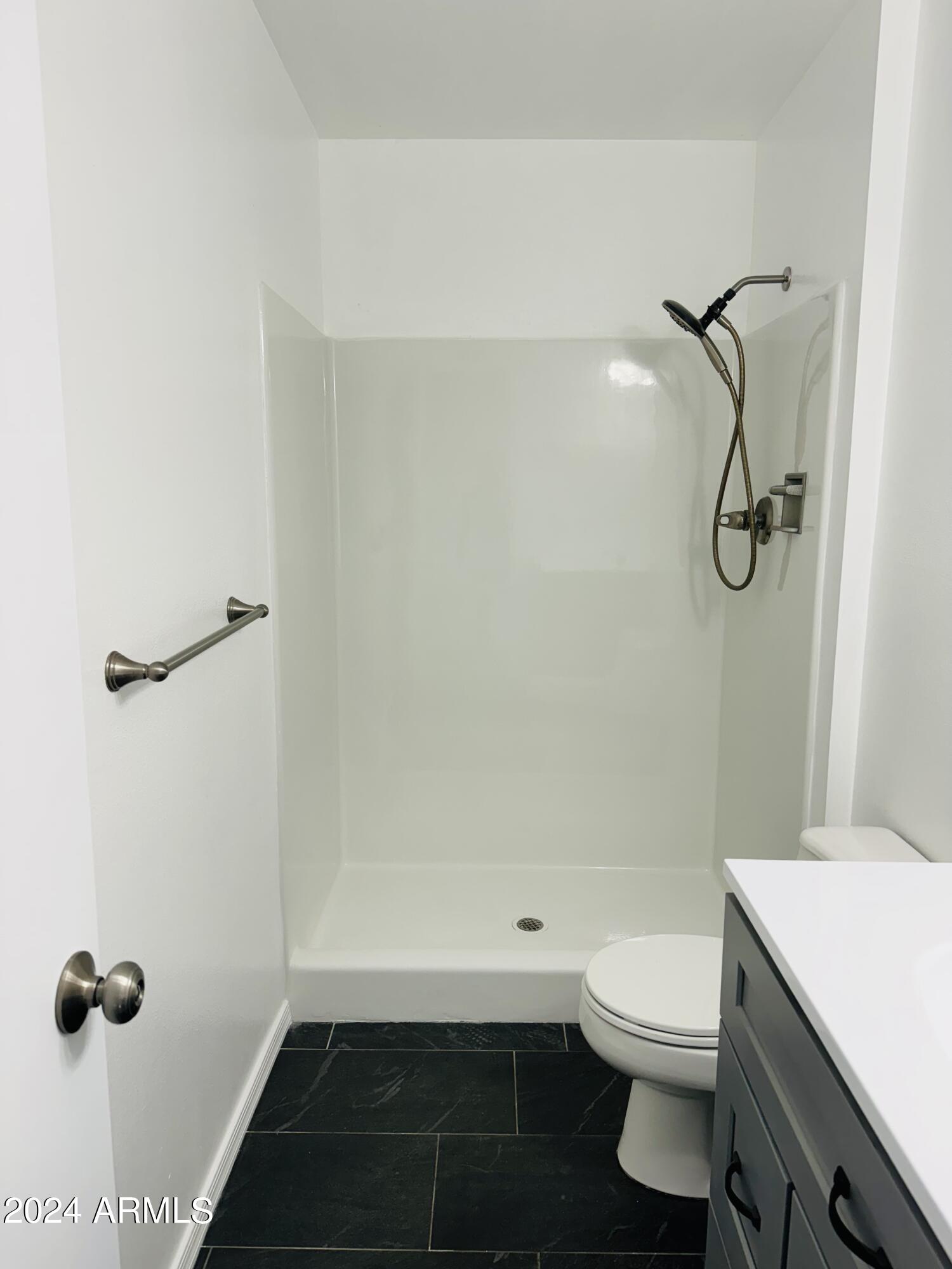 1216 East Riviera Drive Tempe, AZ 85282 - Photo 16 of 33 a bathroom with a granite countertop bathtub shower