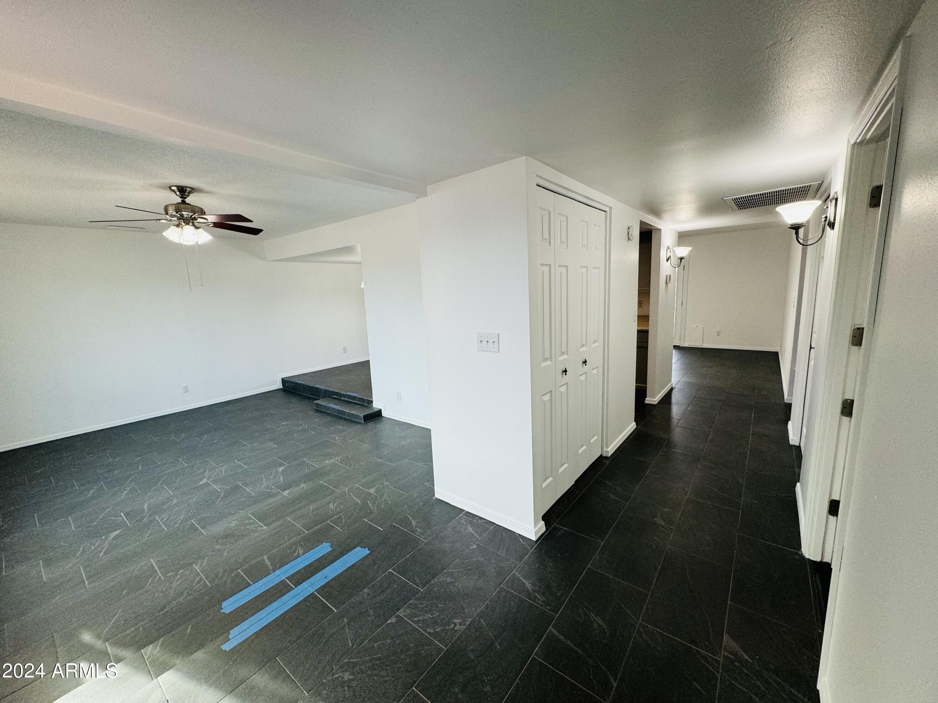 1216 East Riviera Drive Tempe, AZ 85282 - Photo 2 of 33 wooden floor in an empty room