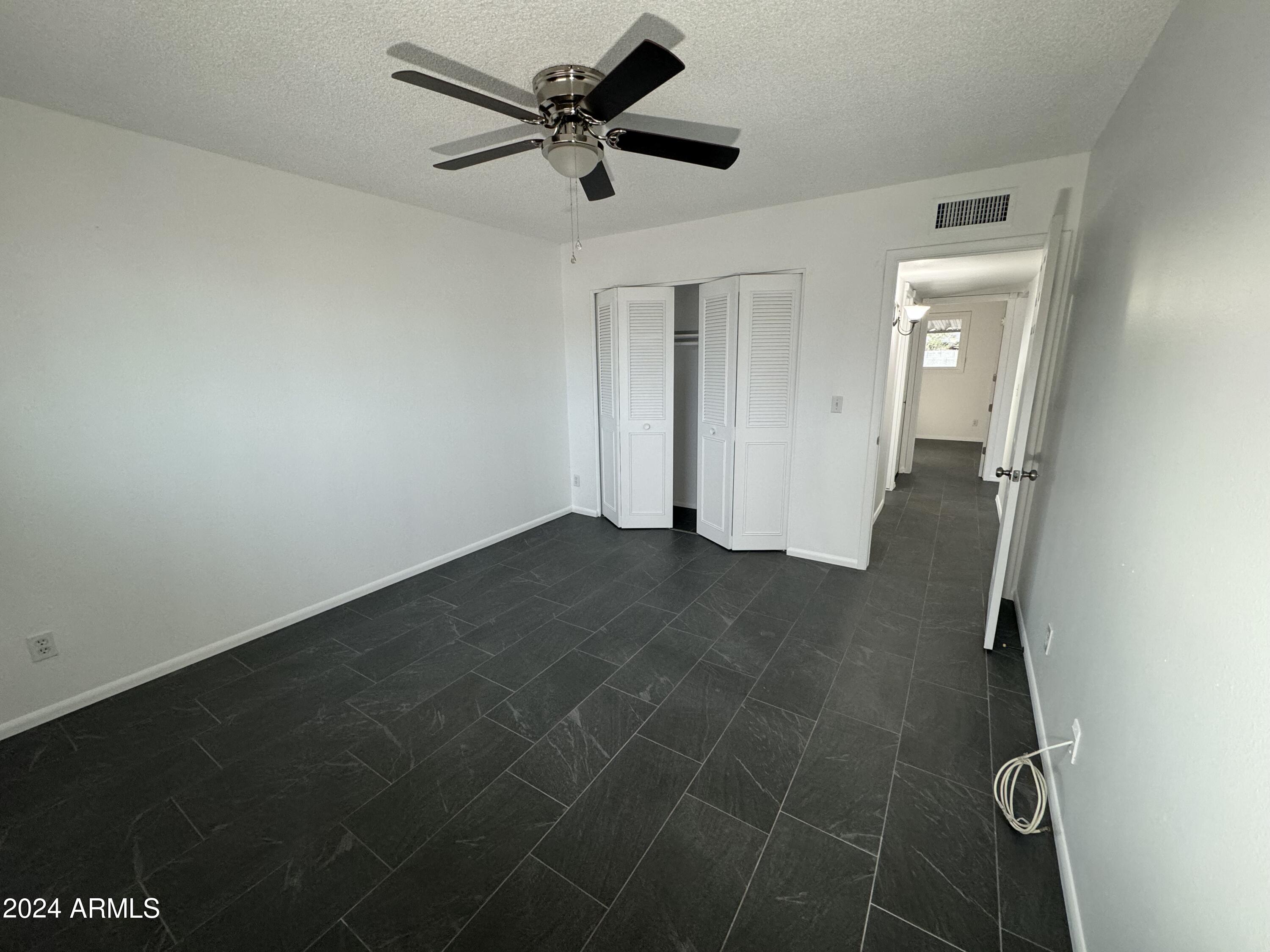 1216 East Riviera Drive Tempe, AZ 85282 - Photo 22 of 33 a view of a hallway with a empty space