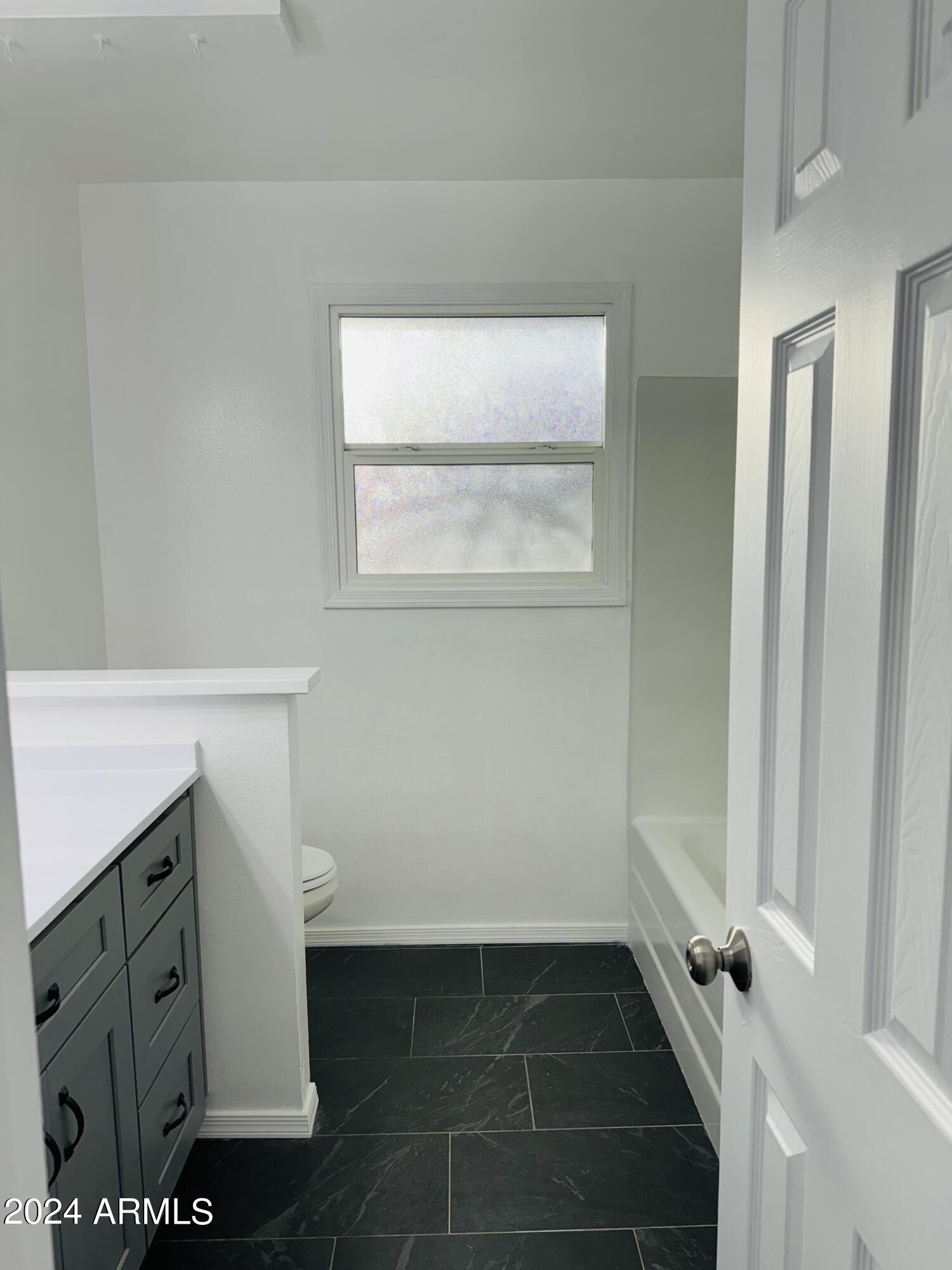 1216 East Riviera Drive Tempe, AZ 85282 - Photo 24 of 33 a bathroom with a sink and a vanity