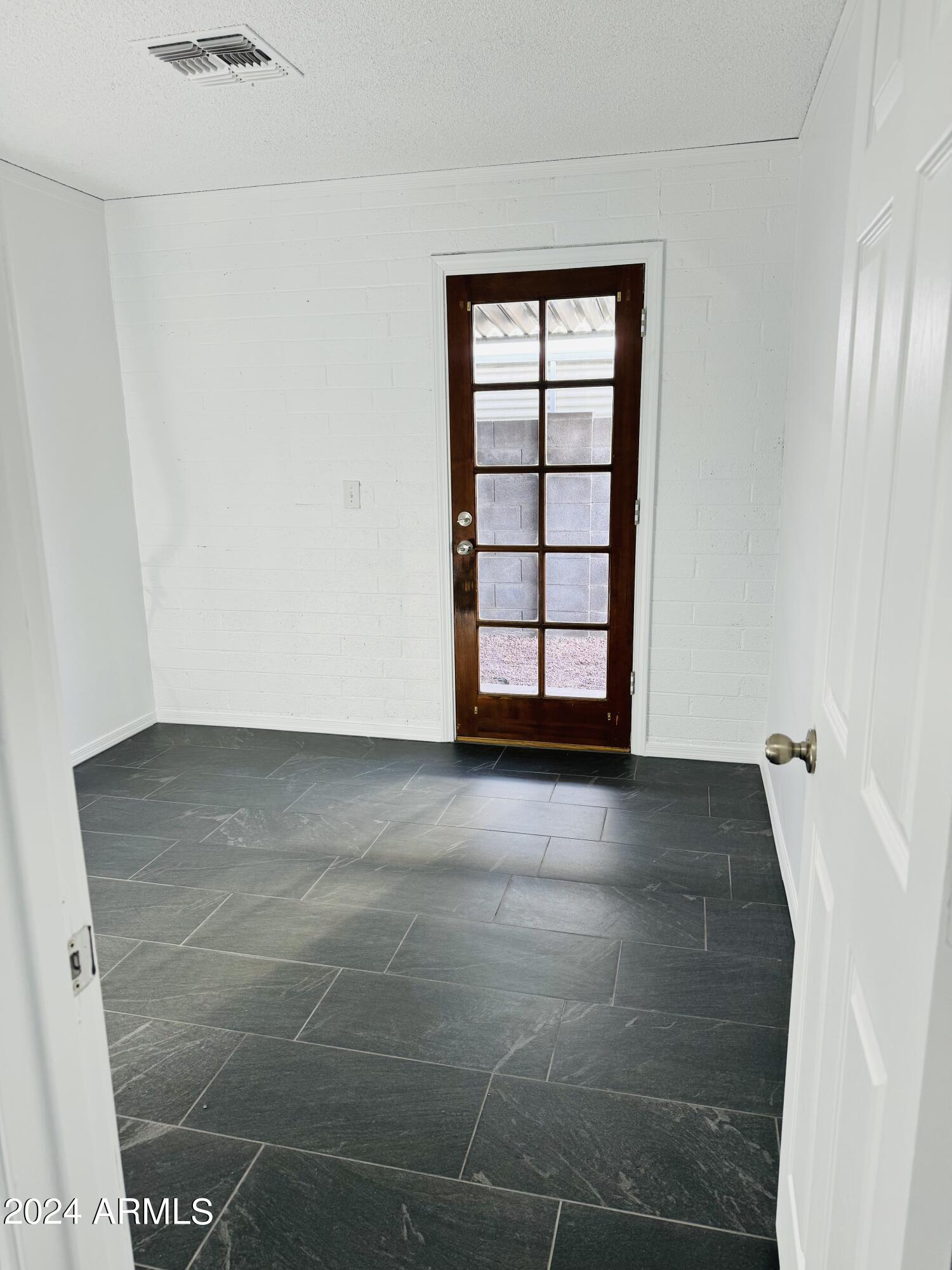 1216 East Riviera Drive Tempe, AZ 85282 - Photo 27 of 33 an empty room with windows