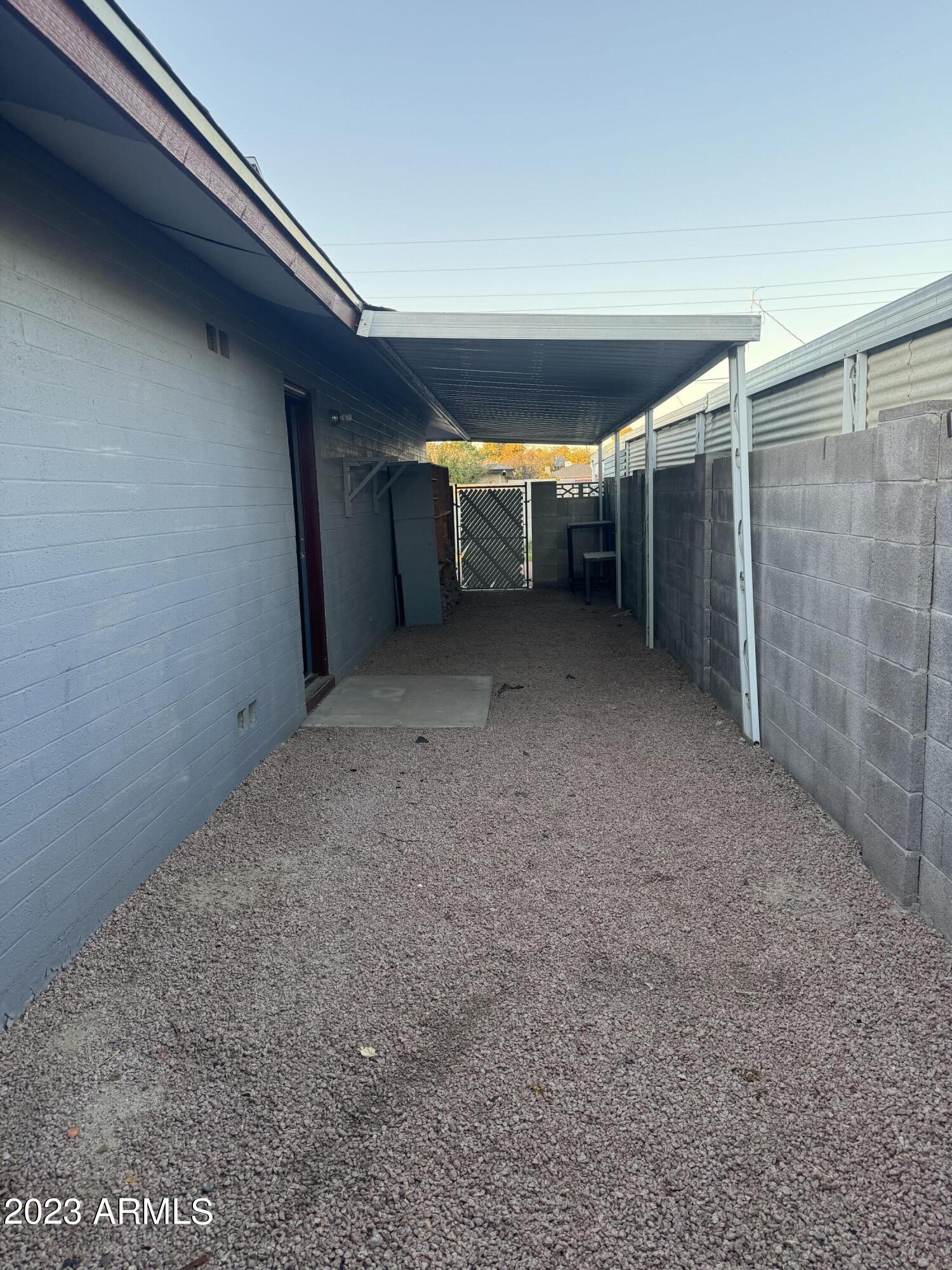 1216 East Riviera Drive Tempe, AZ 85282 - Photo 30 of 33 a view of empty room with wooden floor