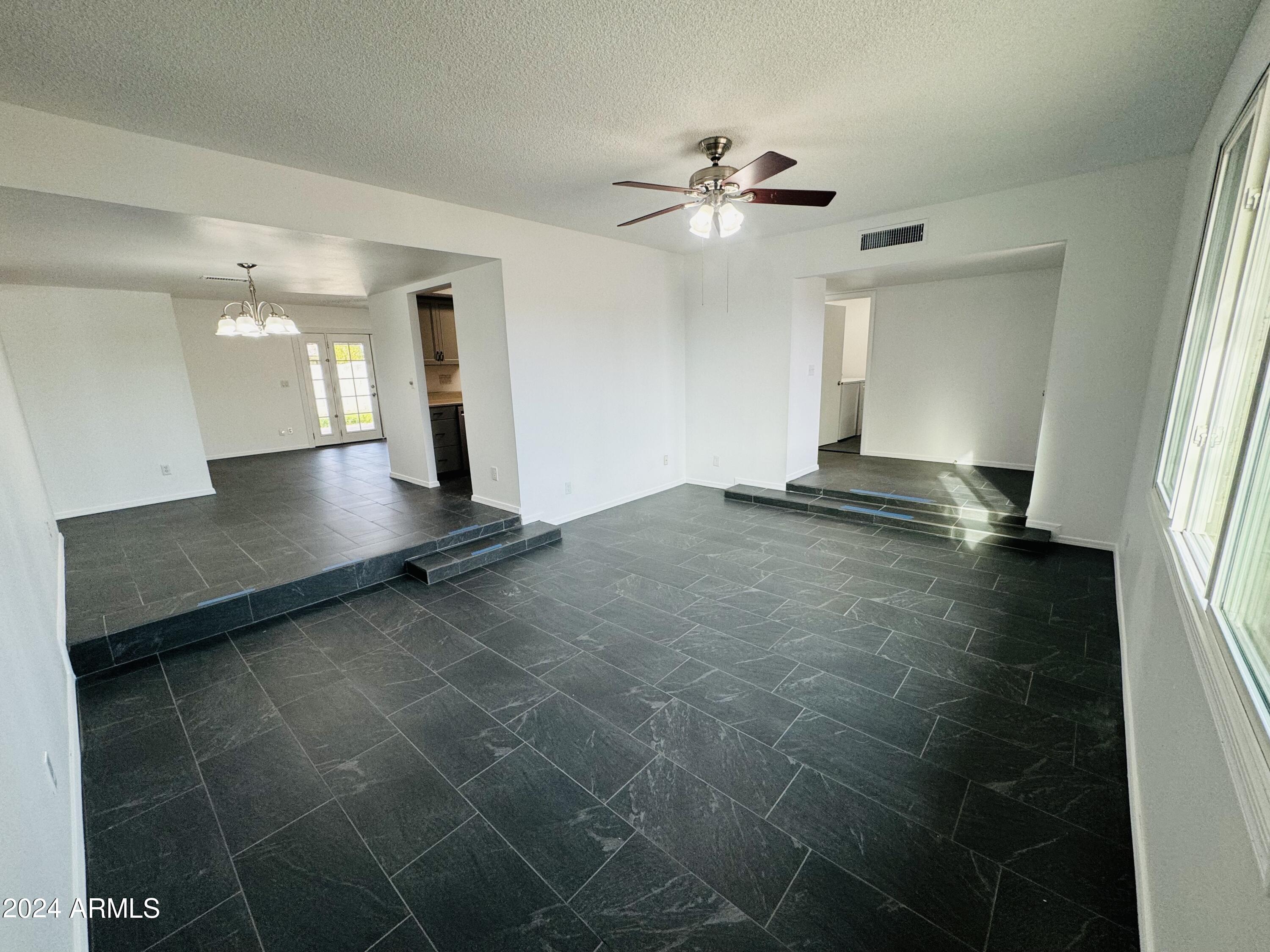 1216 East Riviera Drive Tempe, AZ 85282 - Photo 3 of 33 a view of a livingroom with a ceiling fan and window