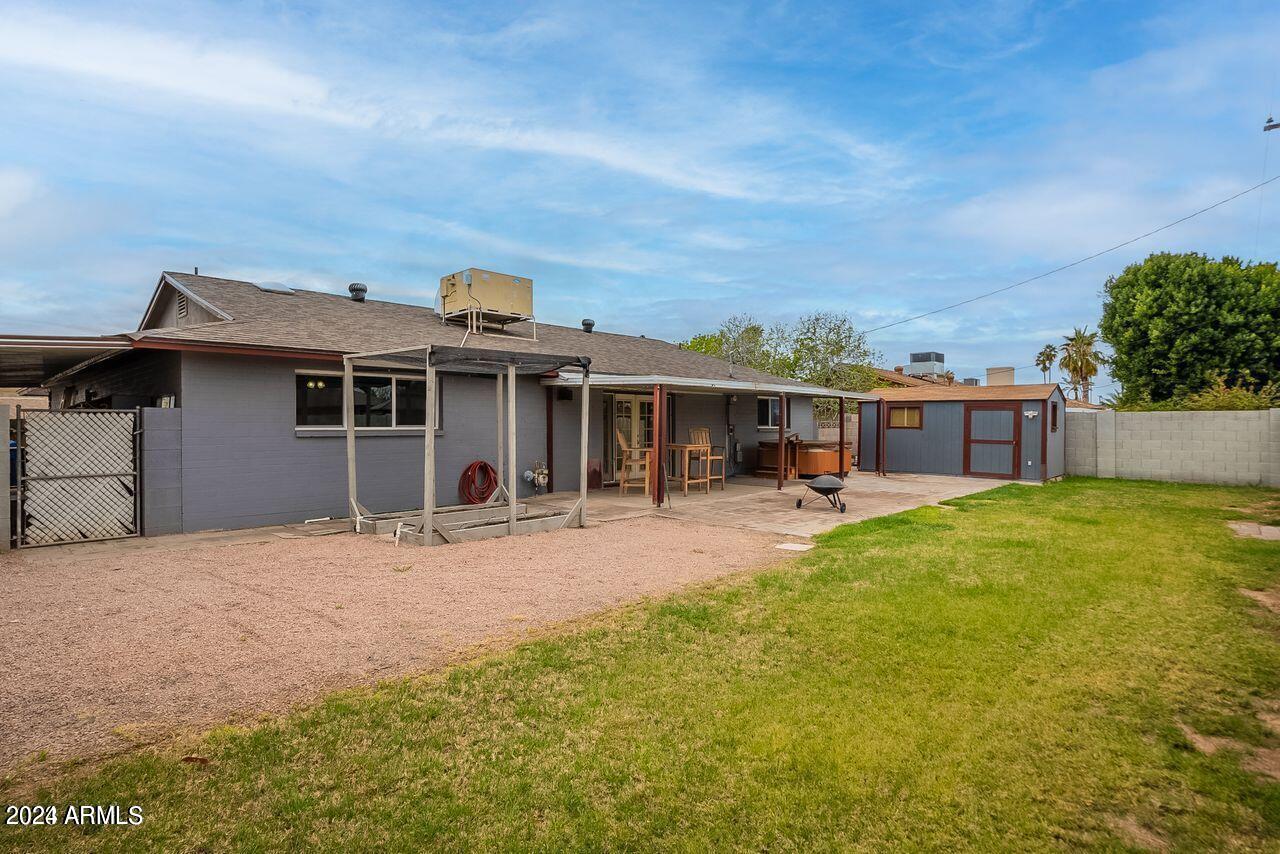 1216 East Riviera Drive Tempe, AZ 85282 - Photo 33 of 33 a front view of a house with a garden
