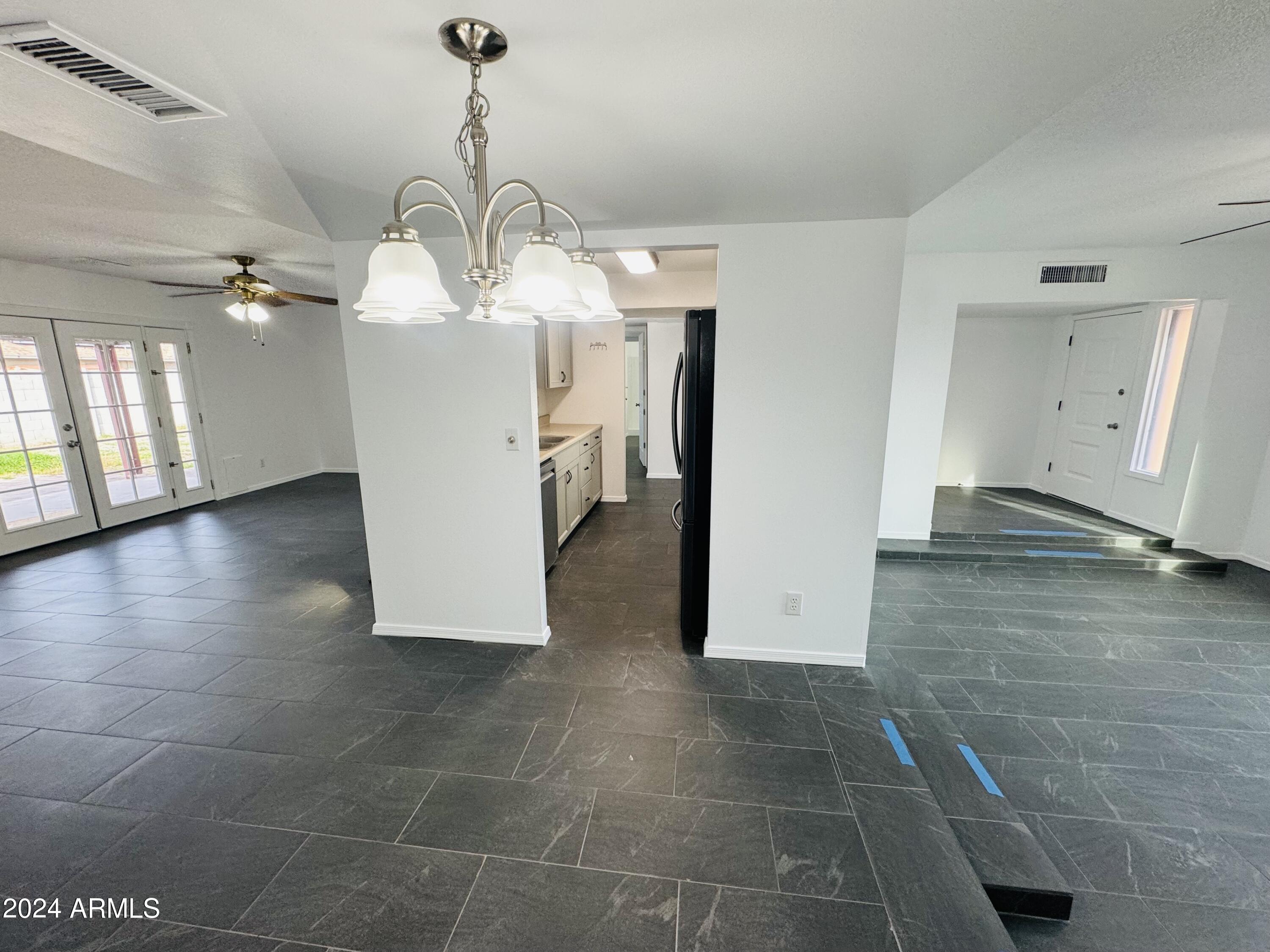 1216 East Riviera Drive Tempe, AZ 85282 - Photo 4 of 33 a view of a kitchen with a sink and cabinets