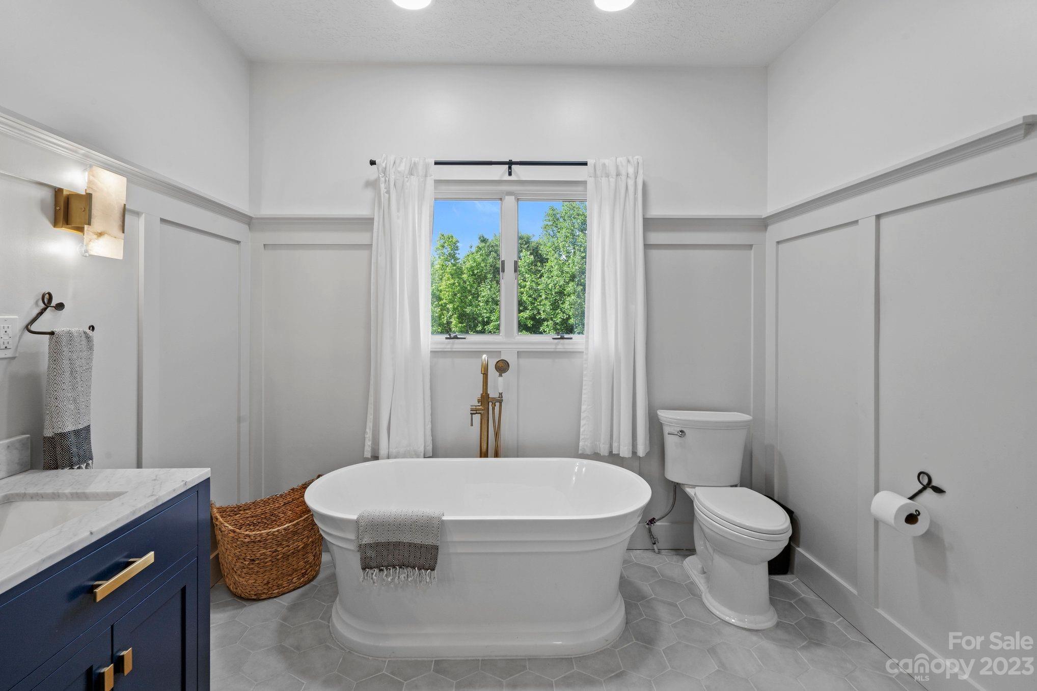 1807 David Drive Shelby, NC 28150 - Photo 15 of 37 a white toilet sitting next to a bathroom sink