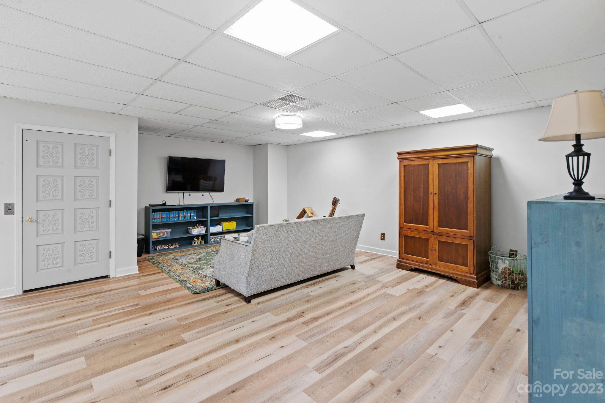1807 David Drive Shelby, NC 28150 - Photo 22 of 37 a living room with furniture and a flat screen tv