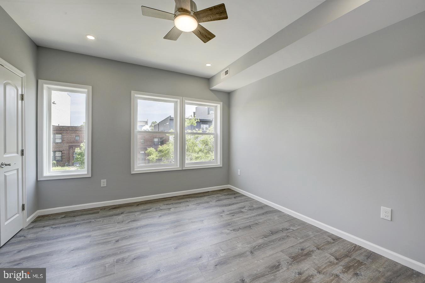 832 19th Street Northeast, Unit B Washington, DC 20002 - Photo 11 of 21 a view of an empty room with a window and wooden floor