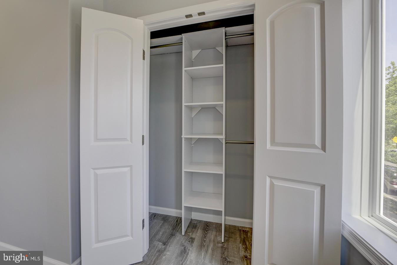 832 19th Street Northeast, Unit B Washington, DC 20002 - Photo 13 of 21 a view of walk in closet with empty racks