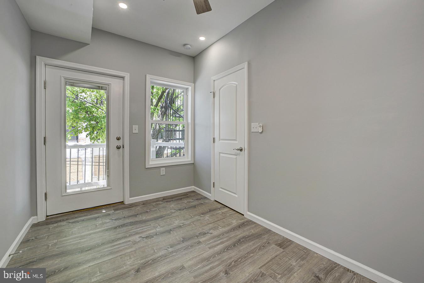 832 19th Street Northeast, Unit B Washington, DC 20002 - Photo 15 of 21 a view of an empty room with wooden floor and a window