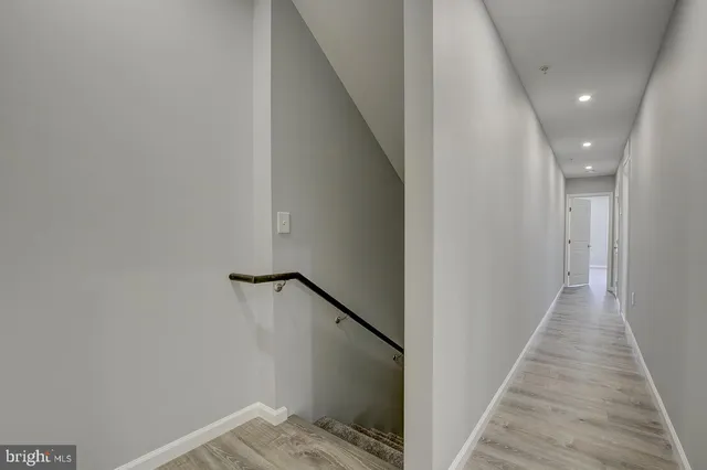 a view of a hallway with stairs