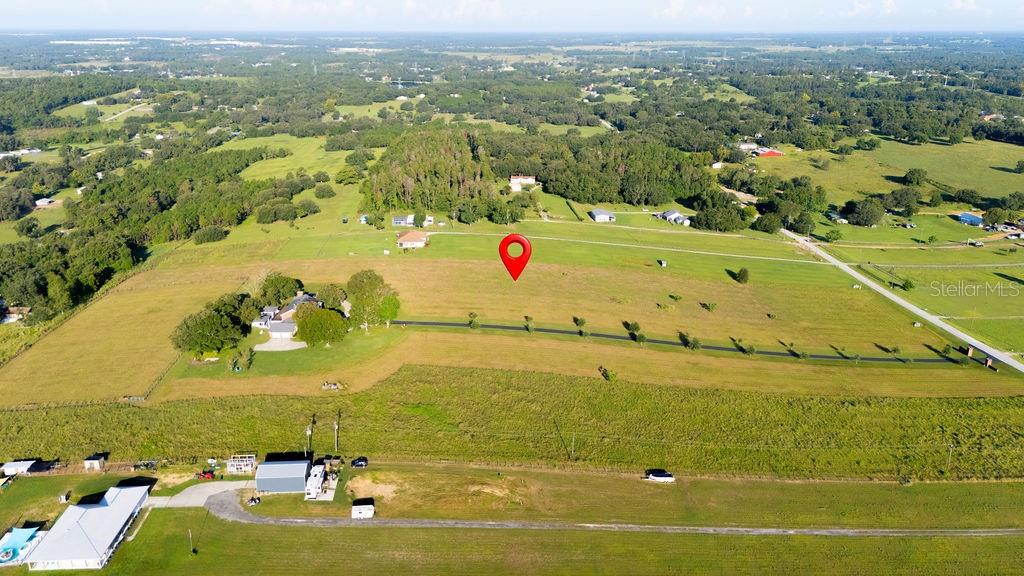 12066 Bruce Hunt Road Clermont, FL 34715 - Photo 4 of 18 an aerial view of residential houses with outdoor space