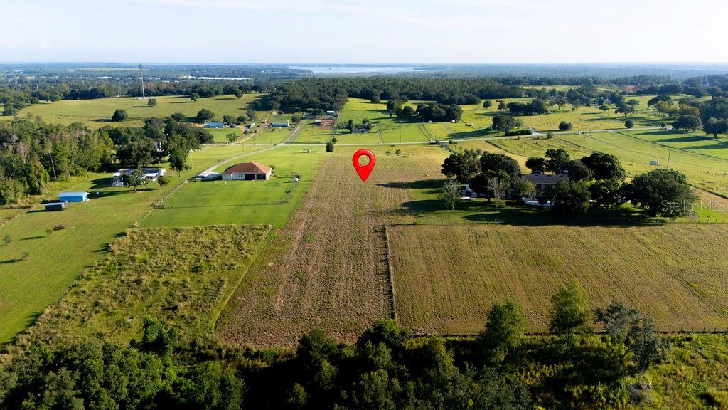 12066 Bruce Hunt Road Clermont, FL 34715 - Photo 9 of 18 an aerial view of residential houses with outdoor space