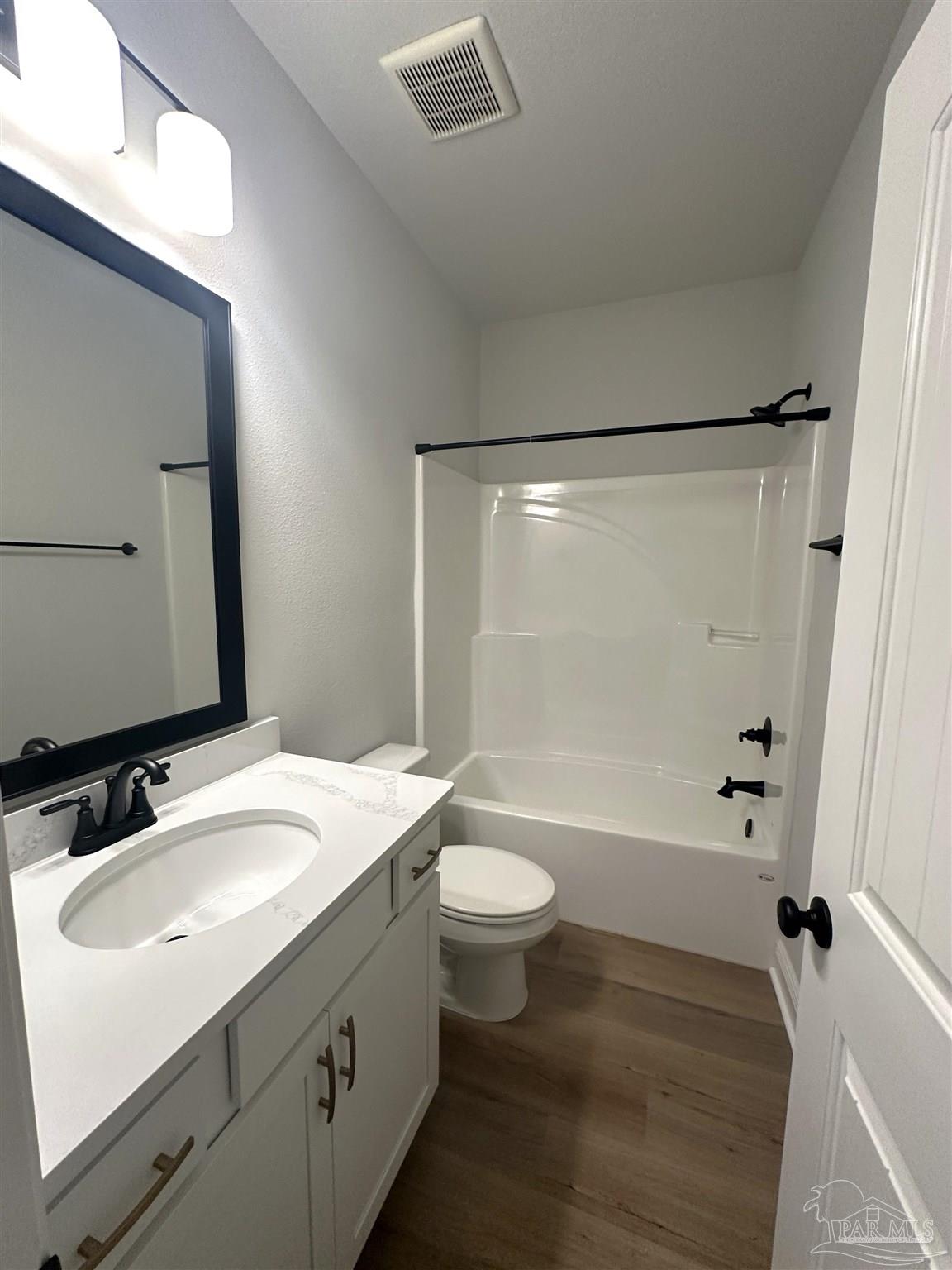 4753 Sago Palm Circle Pace, FL 32571 - Photo 17 of 24 a bathroom with a sink a toilet and shower